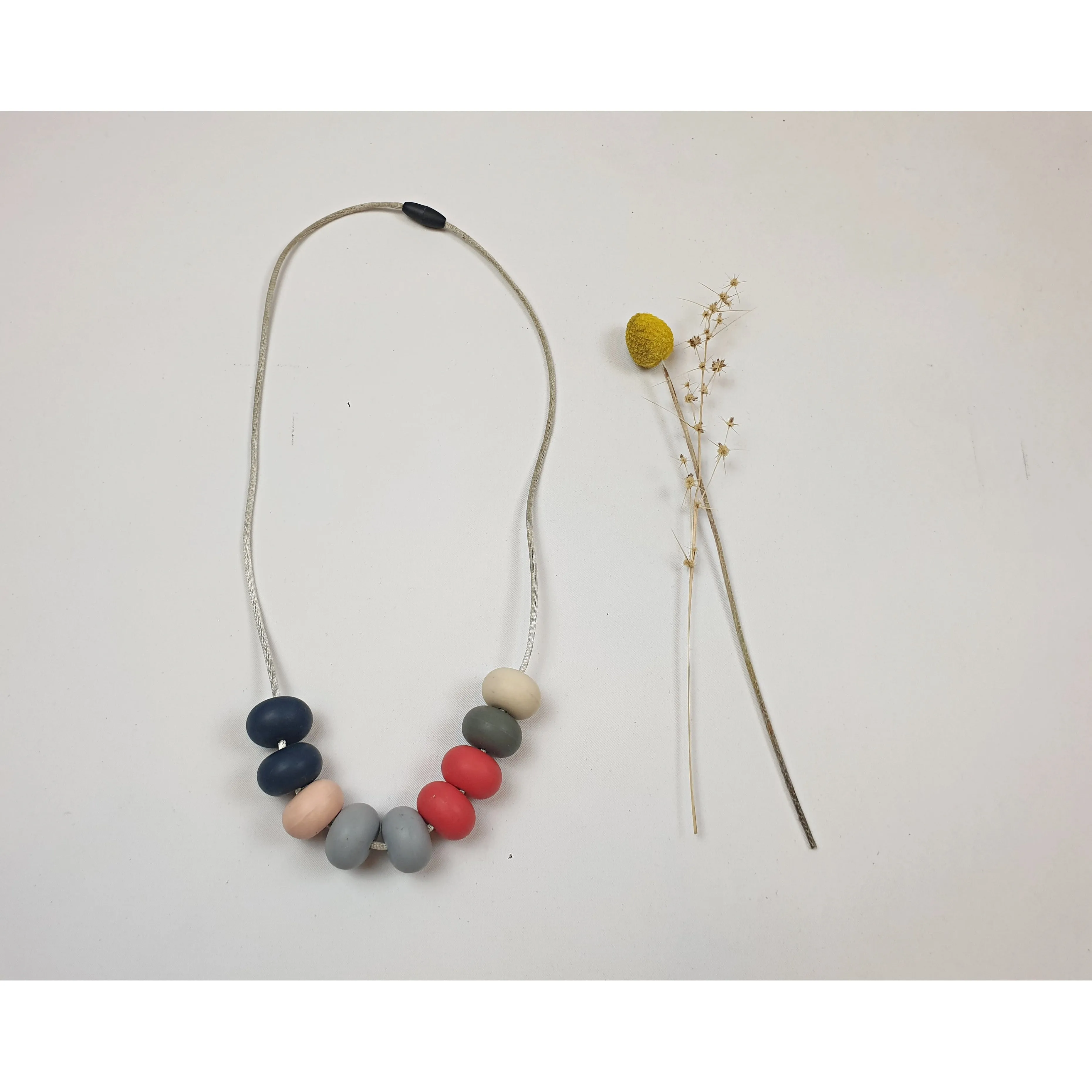 Colourful rubber feel beaded necklace with grey non-leather twine