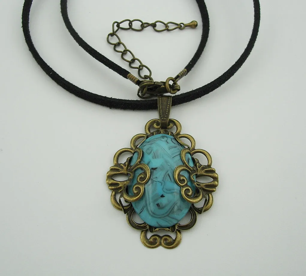Turquoise Lucite Oval Cabochon Filigree Wrapped Suede Cord Necklace.