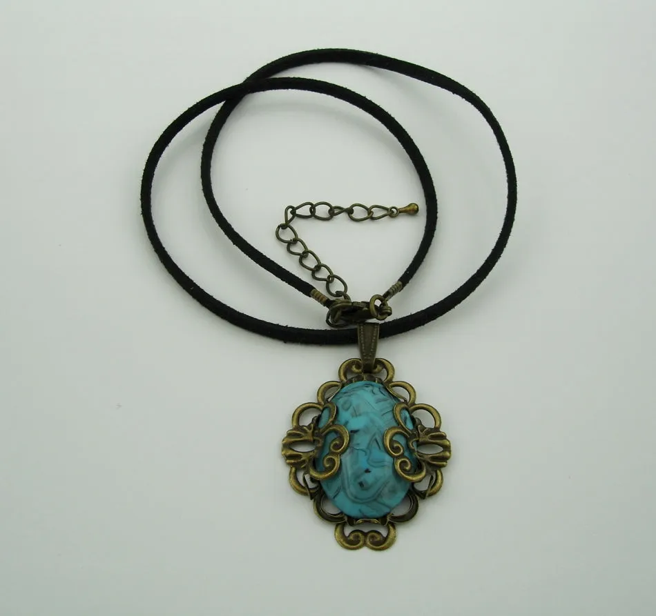 Turquoise Lucite Oval Cabochon Filigree Wrapped Suede Cord Necklace.