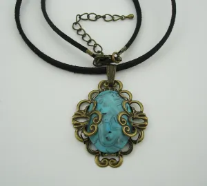 Turquoise Lucite Oval Cabochon Filigree Wrapped Suede Cord Necklace.