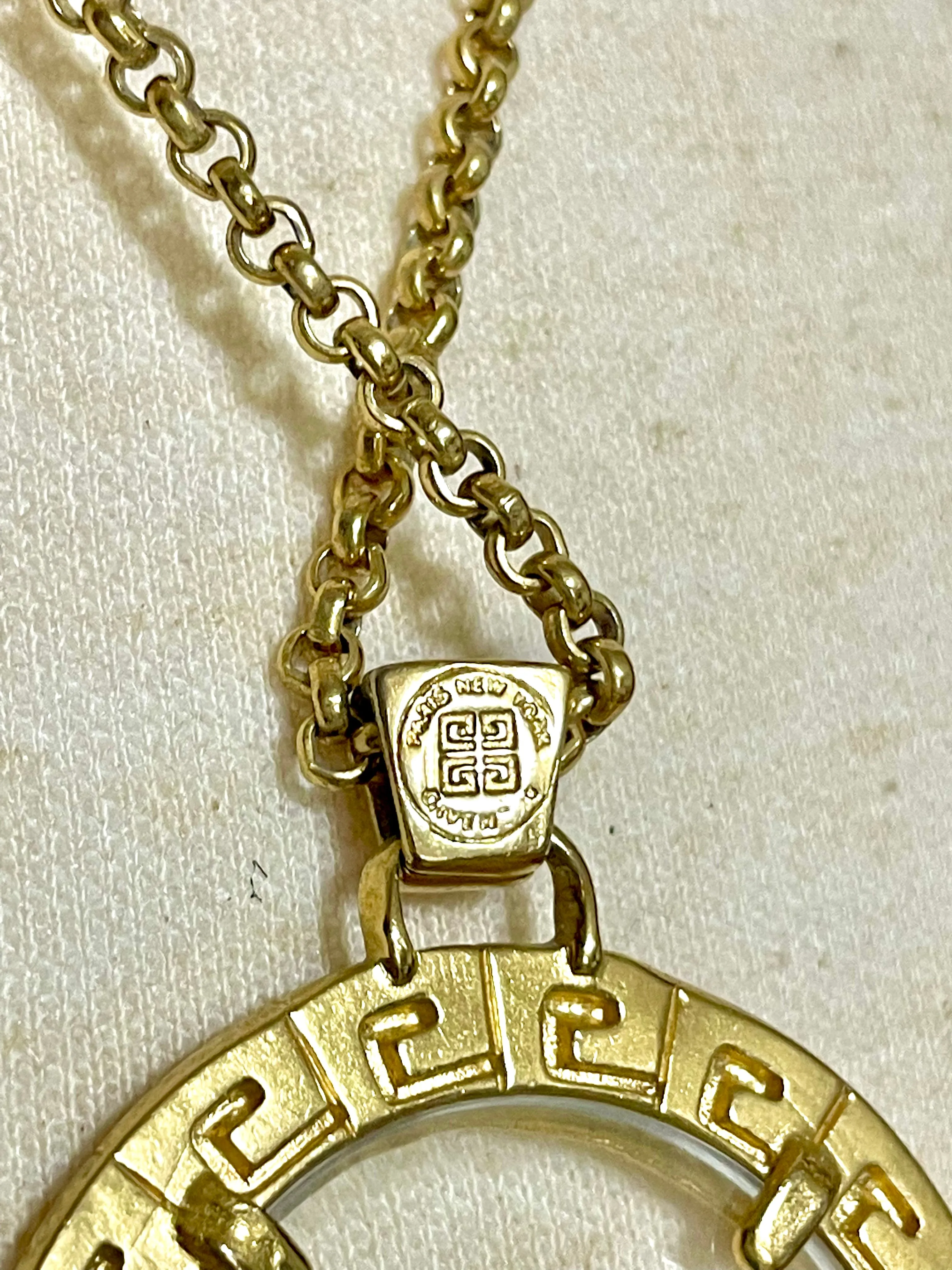 Vintage Givenchy golden chain necklace with round loupe top. Must have statement necklace. 0409274